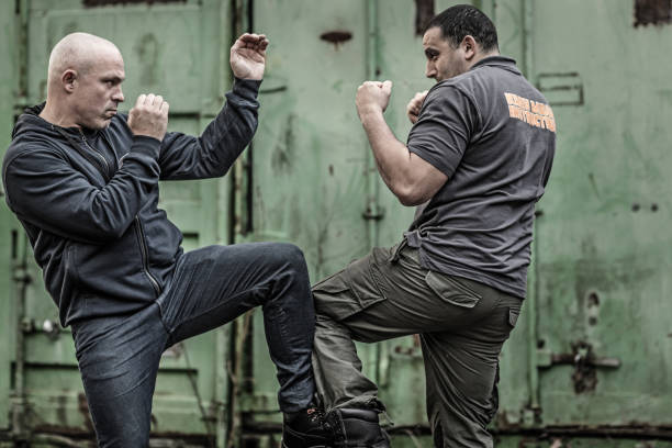 istock Krav Maga fighting duo sparring during training session in grimy outdoor setting 913091096