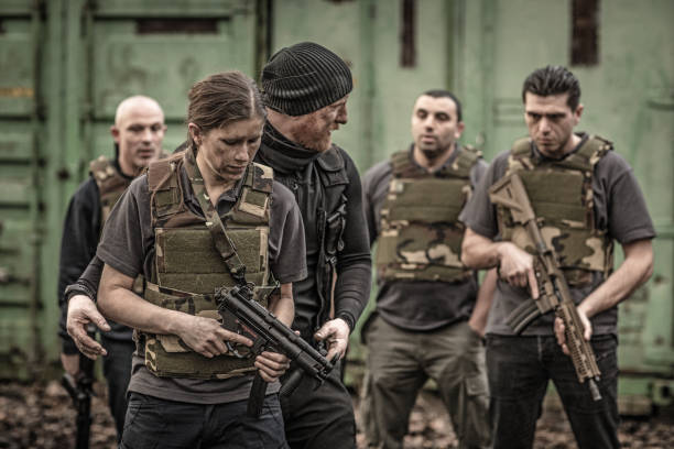 istock Krav Maga fighting instructor leading a training session in grimy outdoor setting 913094330
