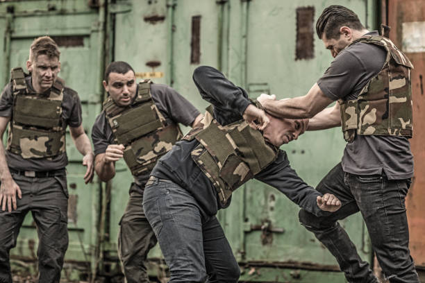 istock Krav Maga fighting group sparring during training session in grimy outdoor setting 913094526
