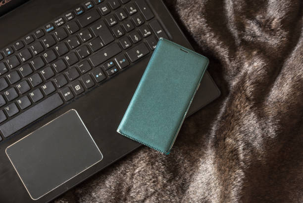 istock Laptop with Smartphone on a bed 913097974