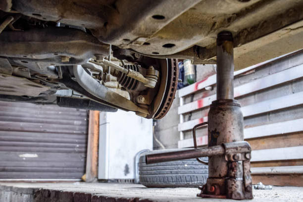 istock Forged car for a hundred. Car repair. Car view from below 913098708