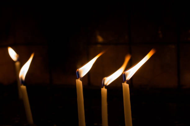 istock Burning candles give light in the dark 913105628