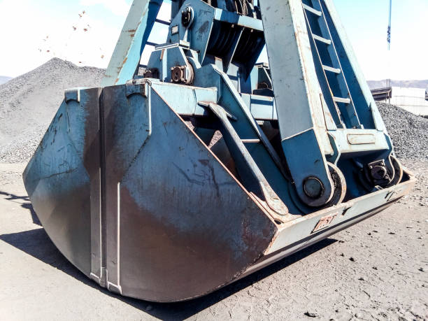 istock Clamshell bucket in the cargo port. Bucket for loading coal 913105830