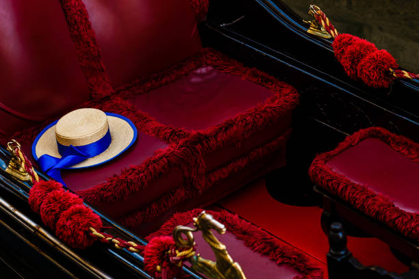 gondola inside the gondolier's hat lies - venice italy veneto architecture blue imagens e fotografias de stock
