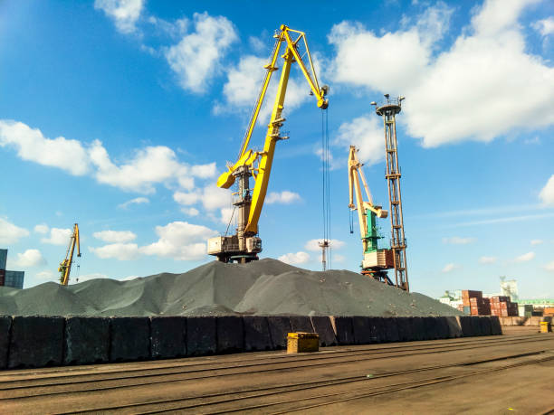 cargo industrial port, port cranes. loading of anthracite. transportation of coal. heap of coal - coal crane transportation cargo container imagens e fotografias de stock