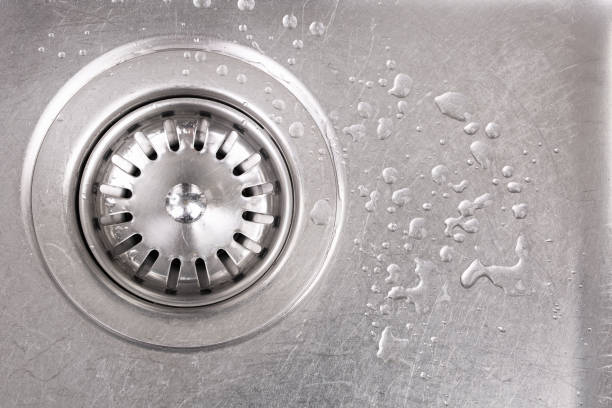 istock Close-up of a kitchen sink, drain strainer and water spots 913106572