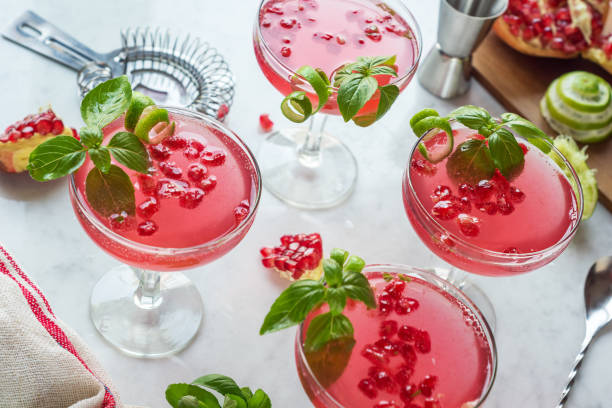 istock Pomegranate Basil Martinis or Gin Smash Cocktails with Ingredients and Tools on Bar 913107006