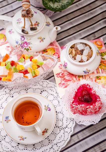 istock Porcelain cup of tea with lemon and sweets 913114854