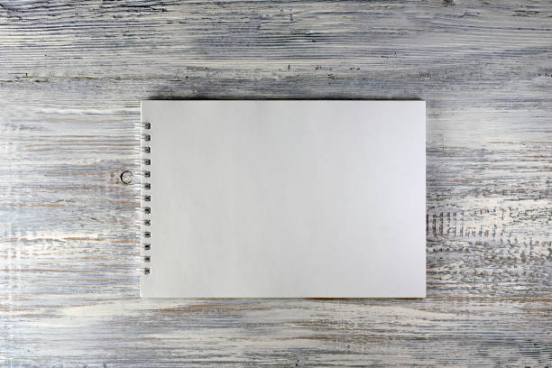 istock white paper on old wooden background,copy space 913125942