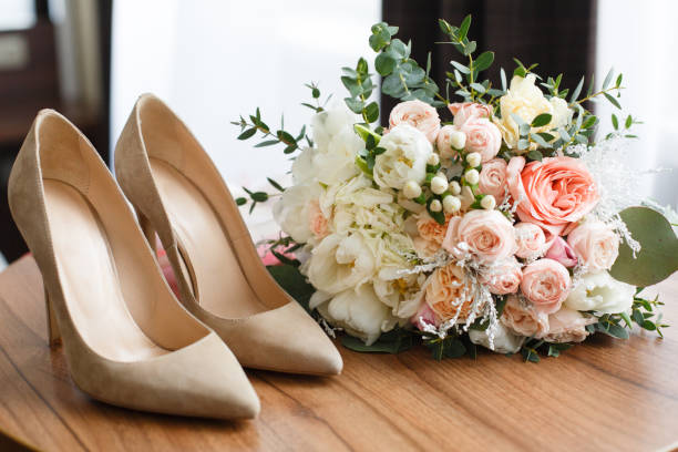 istock wedding shoes and wedding bouquet 913128260