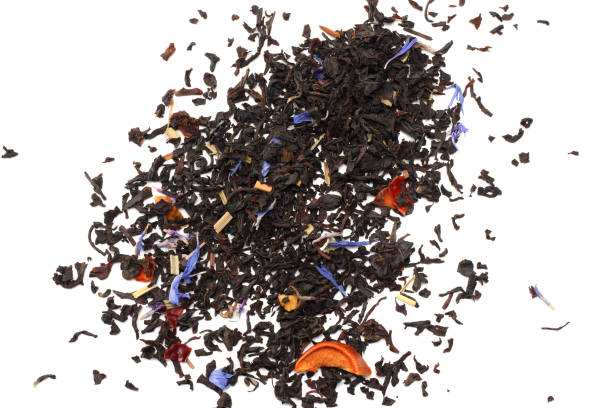 istock Aromatic black dry tea with petals isolated on white background top view 913134254