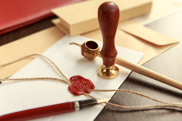 istock Notary's public pen and stamp on testament and last will. Notary public tools 913136054