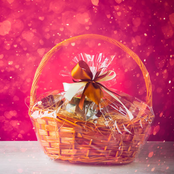 istock gift basket with festive heart particles, purple background 913155788