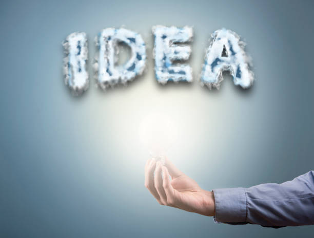 istock Businesswoman holding bulb with cloud sign with text ''IDEA'' (Click for more) 913168850