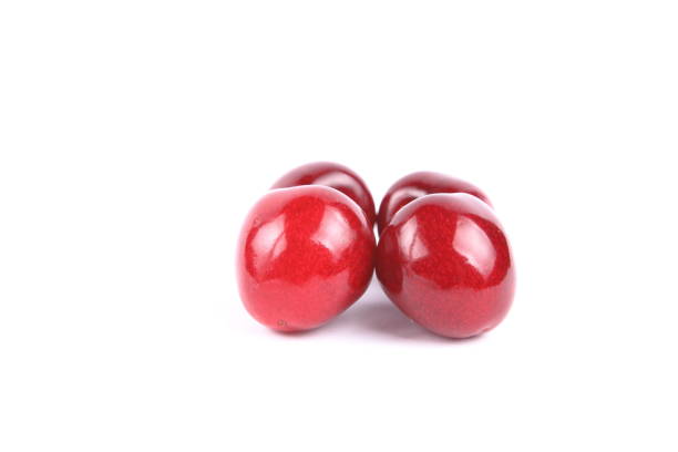 Red cherries on white background, isolated, cherry with blank space for text, fresh red berries, label for designer, vegan, healthy food, cherry