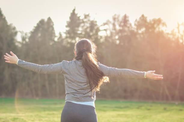 istock Young woman running on the field 913172400