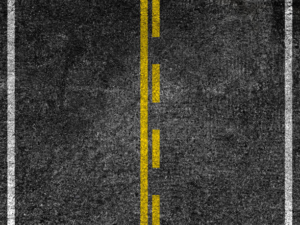 istock Asphalt road with dividing yellow lines. 913172600