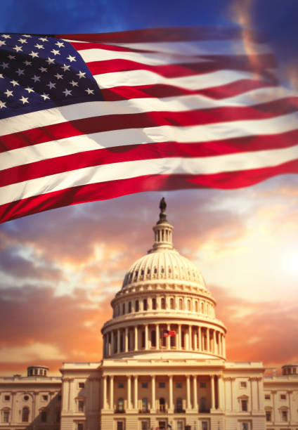 istock American flag with United States Capitol 913172736