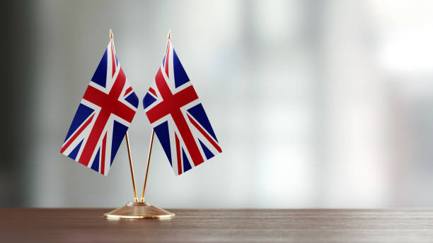 istock British Flag Pair On A Desk Over Defocused Background 913175530