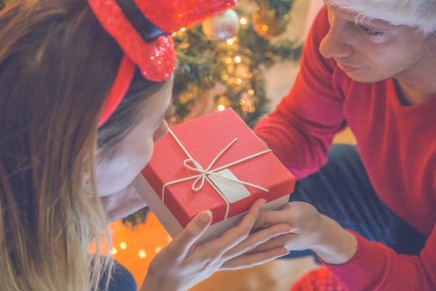 istock Couple Exchanging Christmas Gifts 913179580