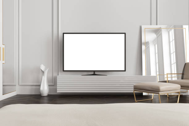 istock White screen TV set in a gray living room 913186824