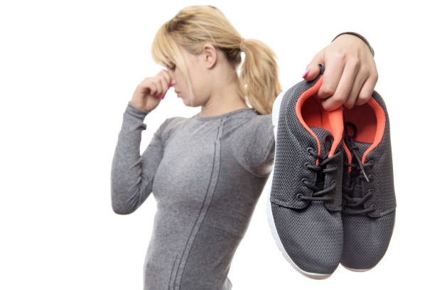 istock woman with smelly shoes 913189748