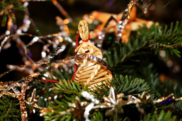 istock The christmas a straw adornment hanging on the tree 913189844