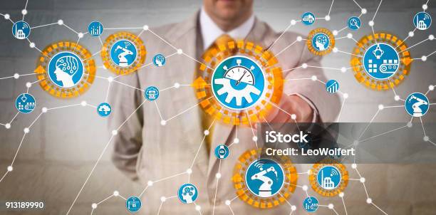 Manager Reconfiguring Industrial Iot Assets Stock Photo - Download Image Now - Learning, Manager, Order