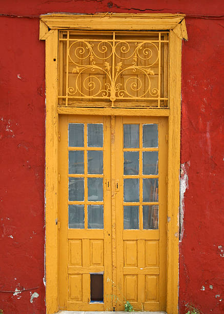 istock yellow door on red wall 91319766