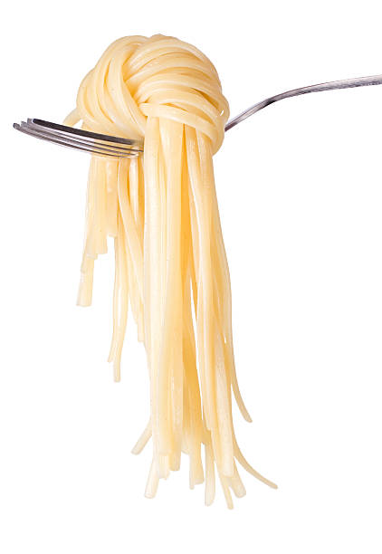 Spaghetti knot on fork stock photo