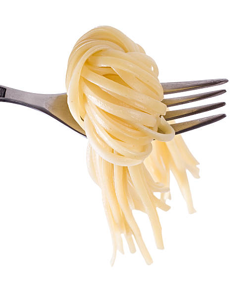 Spaghetti knot on fork stock photo