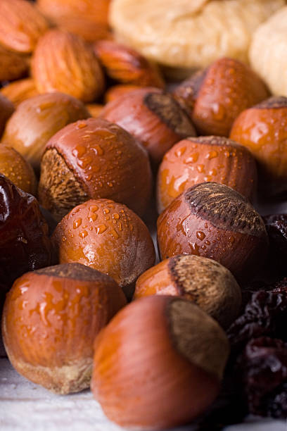 Hazelnuts, figs, prunes and almonds stock photo