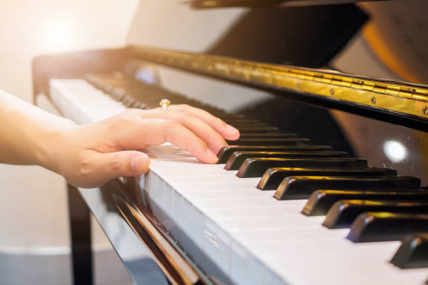 istock Close up musician hand playing piano 913203132