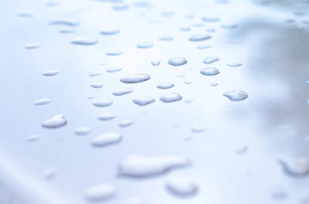 istock texture of a drop of water on a white glossy surface 913203462