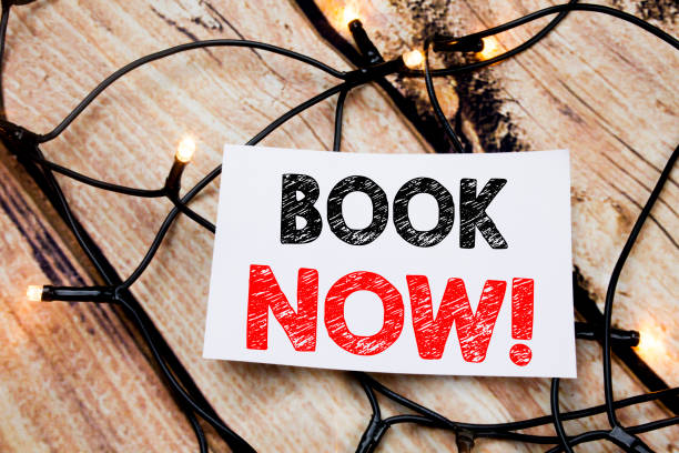 istock Handwritten text caption showing Book Now. Business concept writing for Reservation Booking written on sticky note paper on the wooden background. 913204078