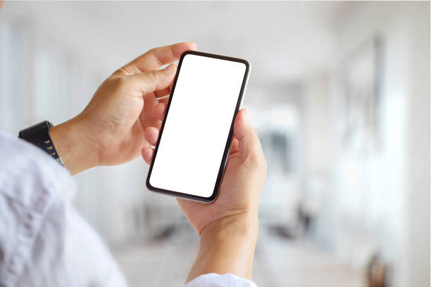 istock Cropped shot hands of businessman holding mobile smartphone in office. 913206830