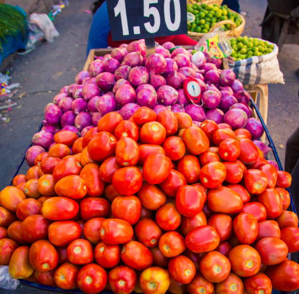 istock Tomatoes and red onions at a market 913213426