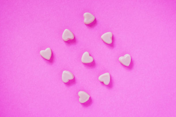 istock valentine candy hearts shape on pink background 913213822