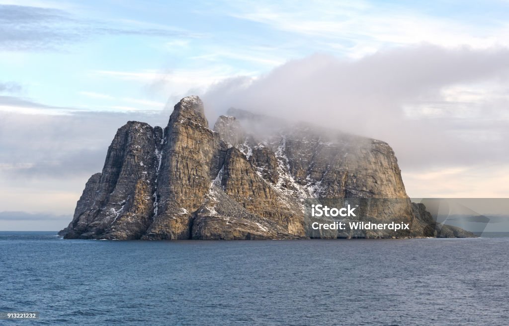 Coastal Clouds on a Barren Island Coastal Clouds on a Barren Island near Baffin Island in Nunavut, Canada Baffin Island Stock Photo