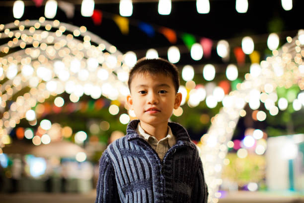 A young Asian boy, 8 years old, at a new year party