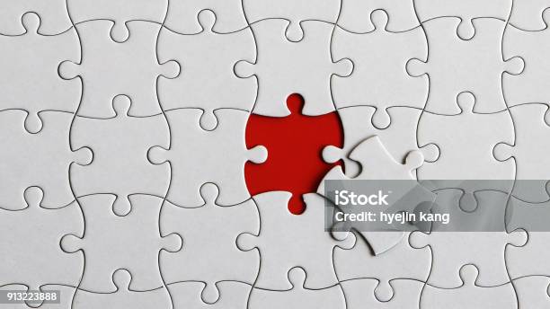A Piece Of A Puzzle And A Missing Piece Of The Puzzle Stock Photo - Download Image Now