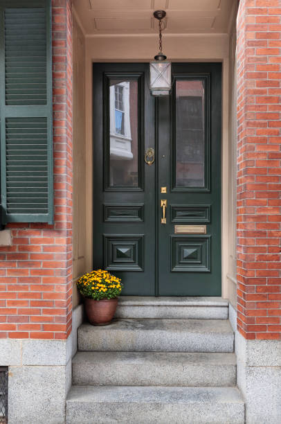istock front black door with brick exterior 913230272