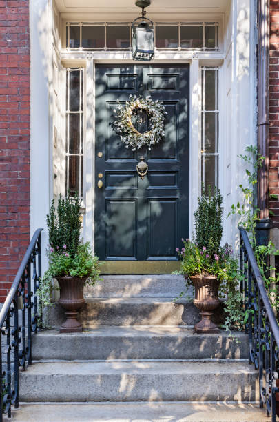 istock Front black door, with wreath hanging from the door. 913230646