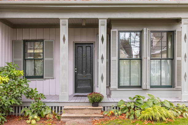 istock Front black door of a rustic neutral colored house 913230990
