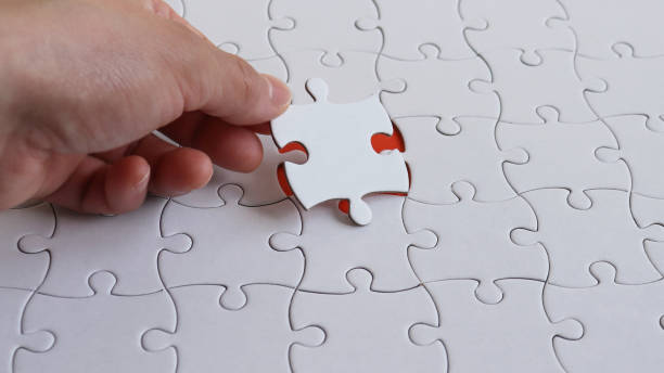 istock The hand holding a piece of the puzzle. 913233688