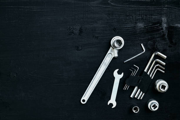 istock Tools for work or repair auto on black wooden background. Top view 913236888