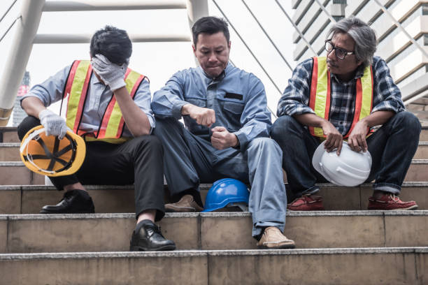 istock Unhappy engineer sitting on building stairs at construction site, They feel tired and stressed from work. 913236952