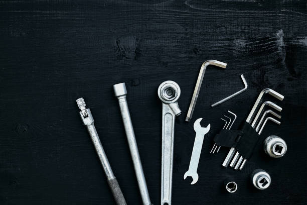 istock Tools for work or repair auto on black wooden background. Top view 913237096