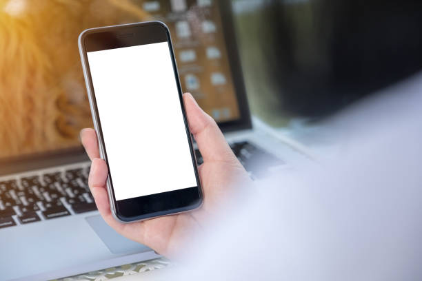 istock Close up Woman hand Using a Smart Phone with blank screen at cafe coffee shop. 913237278