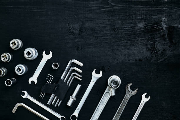 istock Tools for work or repair auto on black wooden background. Top view 913240406